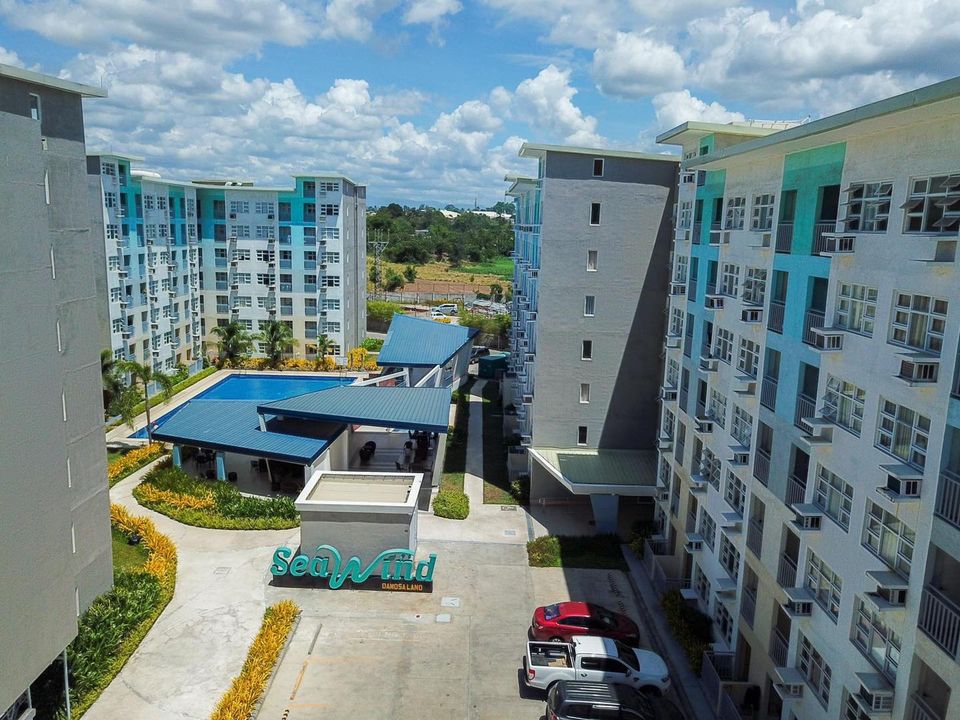 A courtyard with condo apartments around for seawind