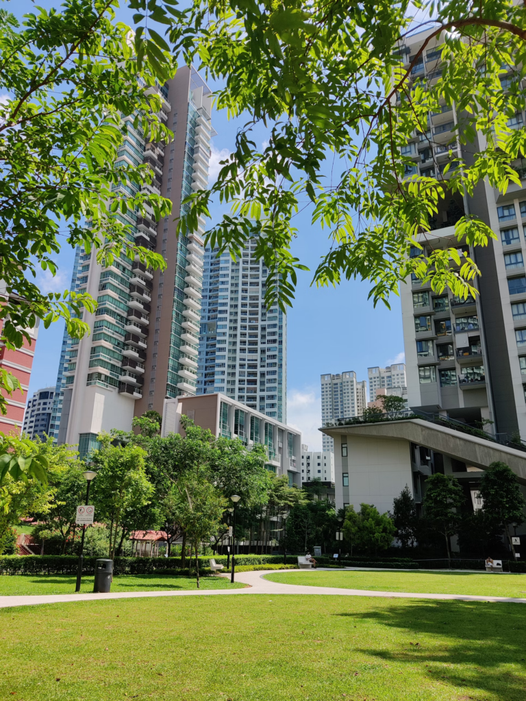 Tall Apartment Building with a beautiful pedestrian strip in the garden